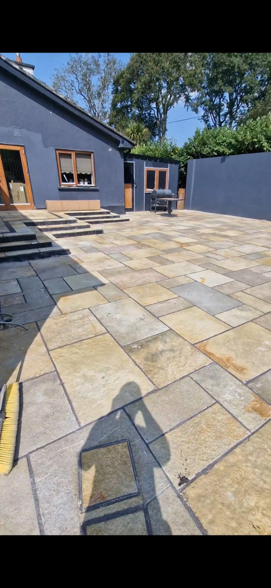Natural stone paving project in Laois with a wide patio and steps | Farrell Exteriors